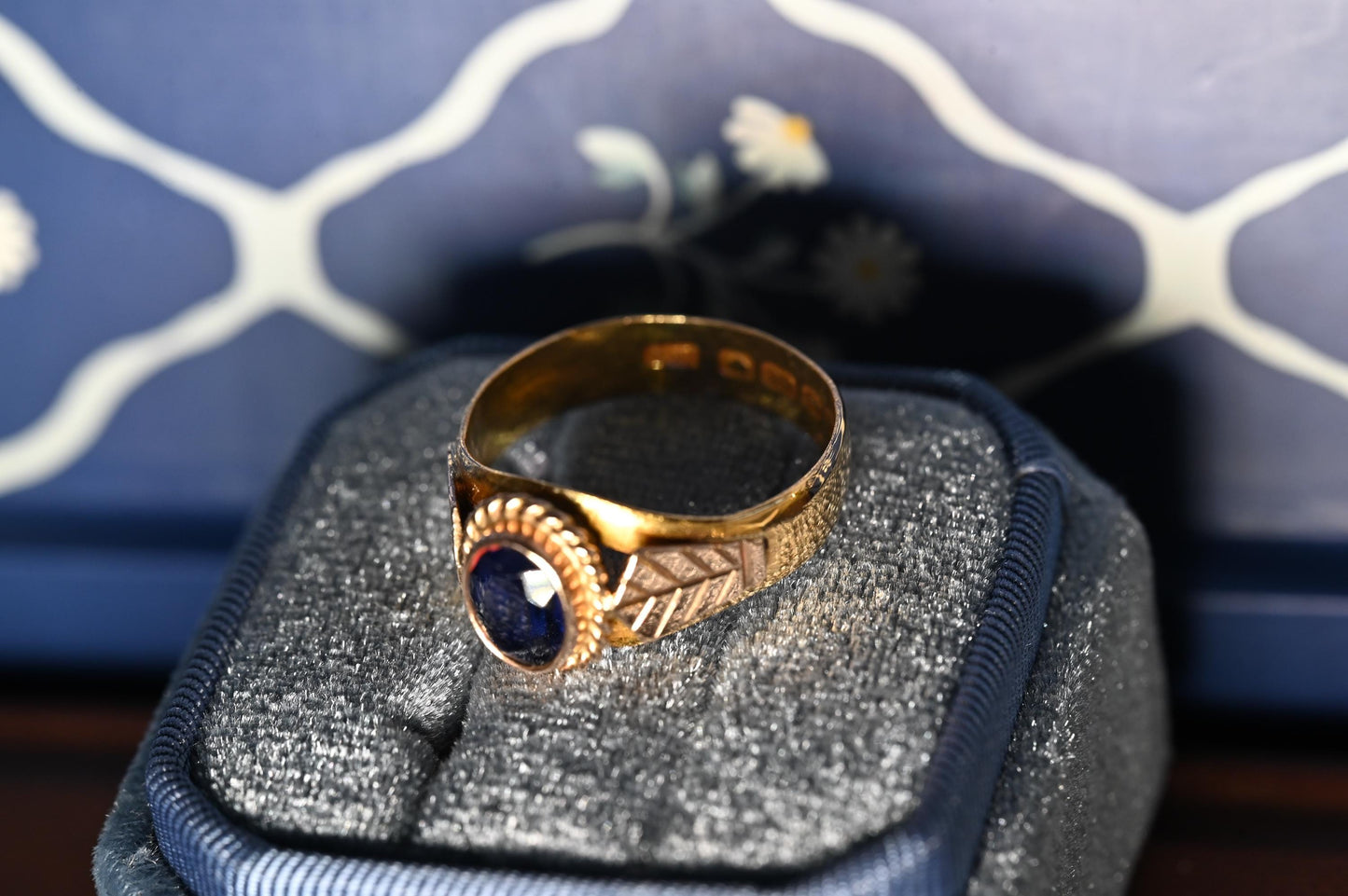 beautiful intricate design and ornate mount with natural deep blue sapphire in 22ct gold from Victorian era