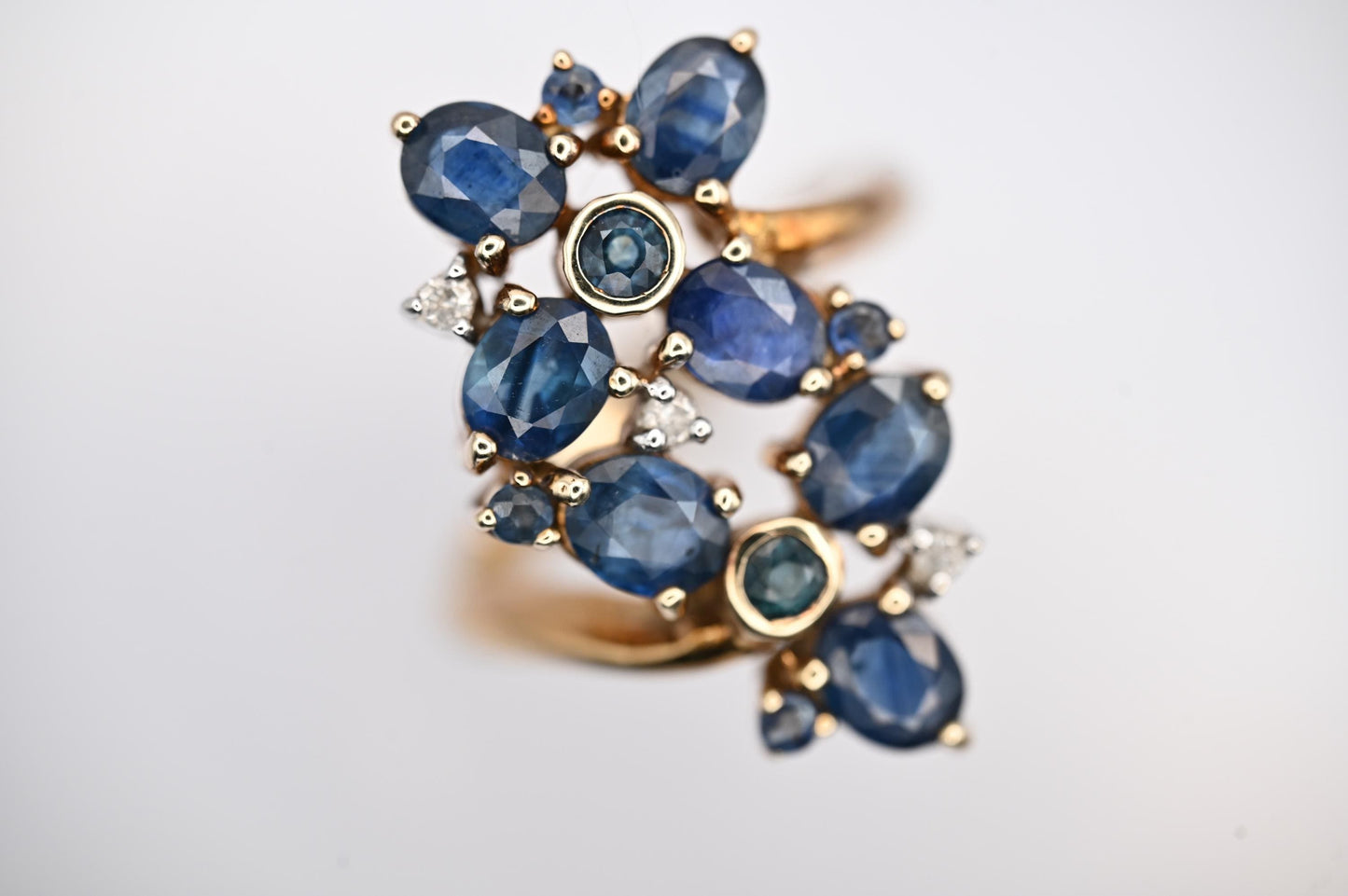 vintage glamorous sparkle ring in floral design inspired by art nouveau style - 9ct yellow gold brings out the blue from 11 sapphire stones