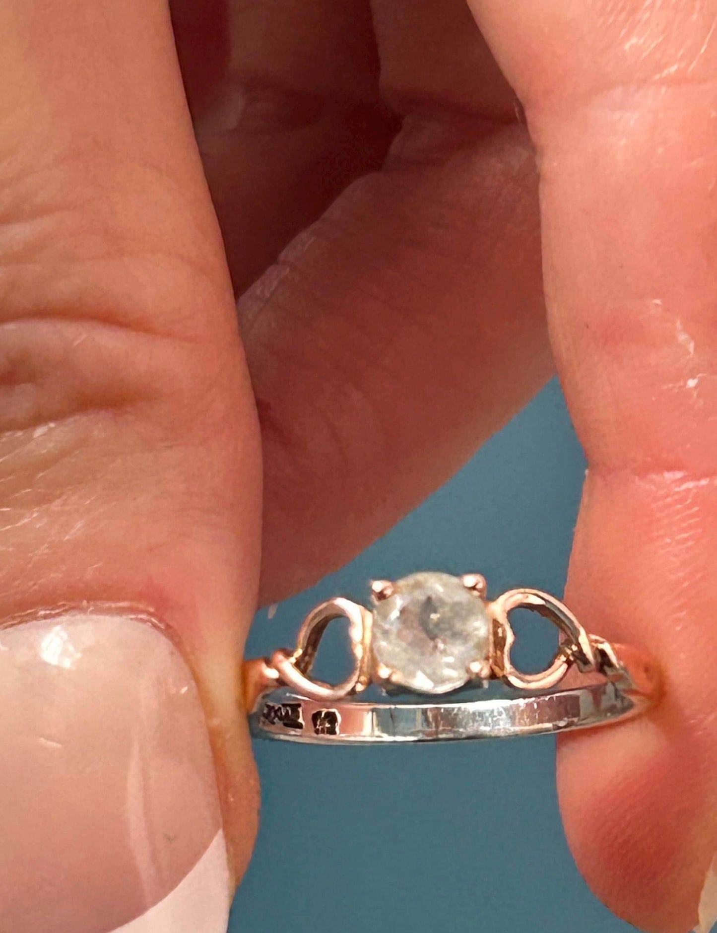 held in hands, unique ring with Welsh love spoon design by Clogau jewellery
