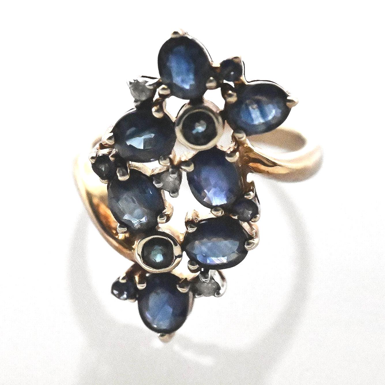 perfect condition the ring is beautifully made with sapphire and white CZ - a glamorous statement ring with floral design