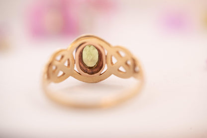pretty peridot showing Celtic weave in 9ct and rose gold from Clogau official Welsh gold, back of stone shown - clear and bright real stone.