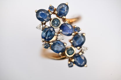 vintage glamorous sparkle ring in floral design inspired by art nouveau style - 9ct yellow gold brings out the blue from 11 sapphire stones