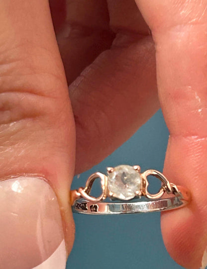 held in hands, unique ring with Welsh love spoon design by Clogau jewellery