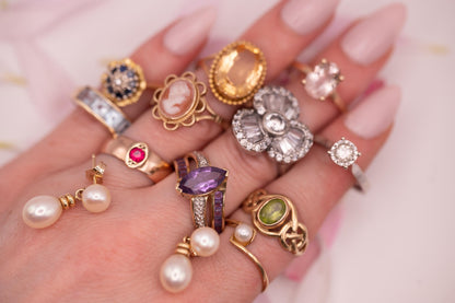 we have a variety of antique and vintage items here the diamond ring is shown on the finger and is beautiful with a dazzling clarity . Very dainty and a pretty vintage Ring