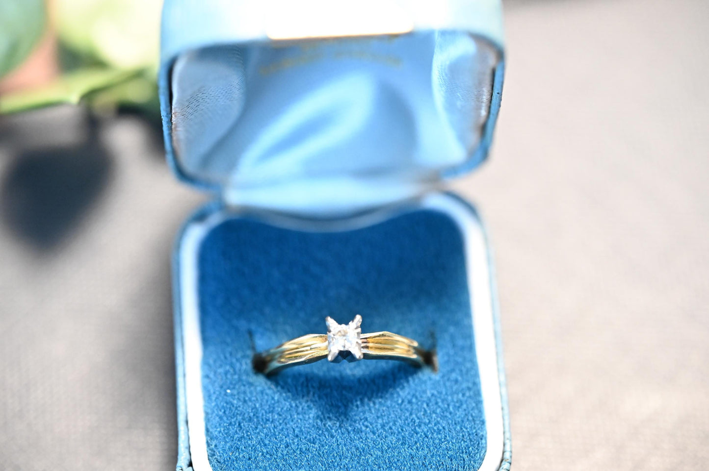 shown in vintage engagement box this stunning ring feature art deco style edging enhancing the brilliant cut white diamond
