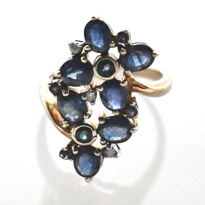 perfect condition the ring is beautifully made with sapphire and white CZ - a glamorous statement ring with floral design