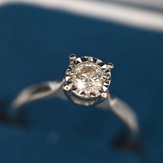up close diamond is dazzling and maintains its beautiful appearance as a 70s vintage item set in white 9 carat gold from the United Kingdom .